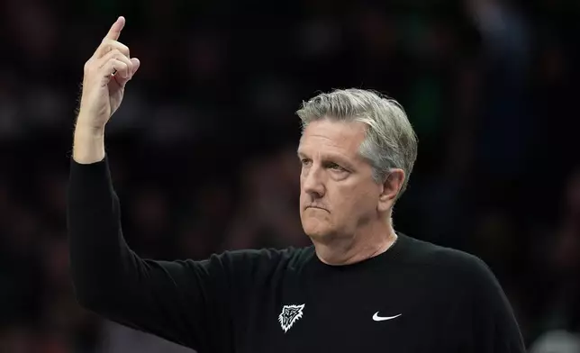 Minnesota Timberwolves head coach Chris Finch calls for the review of a play during the first half of Game 4 of an NBA basketball second-round playoffs series against the San Antonio Spurs in Minneapolis, Sunday, May 10, 2026. (AP Photo/Abbie Parr)