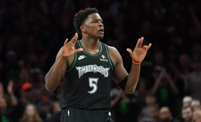 Minnesota Timberwolves guard Anthony Edwards reacts after scoring against the San Antonio Spurs during the first half of Game 4 of an NBA basketball second-round playoffs series in Minneapolis, Sunday, May 10, 2026. (AP Photo/Abbie Parr)
