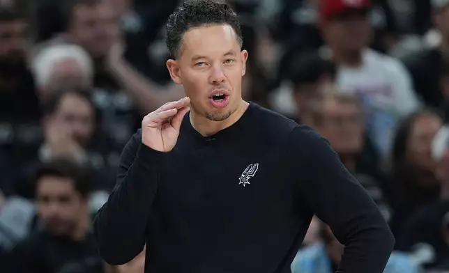 San Antonio Spurs head coach Mitch Johnson talks to his players during the first half in Game 2 of a second-round NBA playoffs basketball series against the Minnesota Timberwolves in San Antonio, Wednesday, May 6, 2026. (AP Photo/Eric Gay)