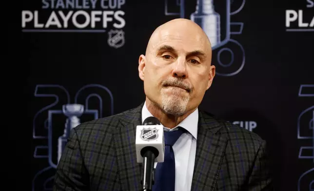 Philadelphia Flyers head coach Rick Tocchet speaks at a news conference following Game 2 of an NHL hockey Stanley Cup second-round playoff series against the Carolina Hurricanes in Raleigh, N.C., Monday, May 4, 2026. (AP Photo/Karl DeBlaker)