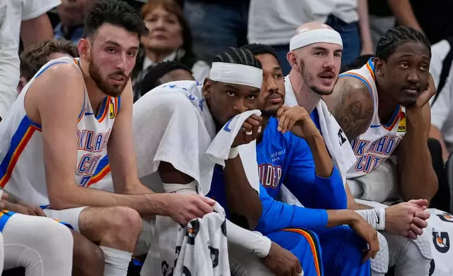 The Oklahoma City Thunder bench watches play against the San Antonio Spurs in the second half of Game 6 in the Western Conference finals NBA basketball playoffs series, Thursday, May 28, 2026, in San Antonio. (AP Photo/David J. Phillip)