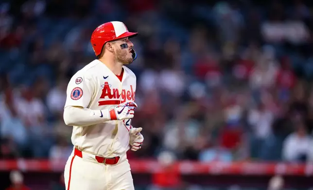Los Angeles Angels' Mike Trout looks on after being walked with the bases loaded to cause a run during the fourth inning of a baseball game against the Athletics, Tuesday, May 19, 2026, in Anaheim, Calif. (AP Photo/William Liang)
