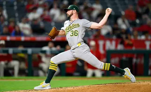 Athletics pitcher Hogan Harris delivers during the eighth inning of a baseball game against the Los Angeles Angels, Tuesday, May 19, 2026, in Anaheim, Calif. (AP Photo/William Liang)