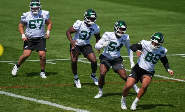 New York Jets' David Bailey (31) takes part in drills with Nick Karika (67), Pascal Ekeji (54) and Nathan Voorhis (69) during rookie minicamp at the NFL football team's practice facility Friday, May 8, 2026, in Florham Park, N.J. (AP Photo/Frank Franklin II)