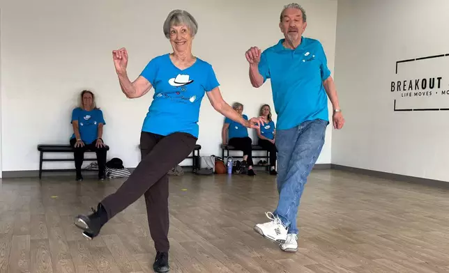 The Rodeo City Wreckettes' Carol Ross 87, and her husband, John, 89, perform a dance to the song, “Let’s Chase Each Other ‘round the Room Tonight" on Thursday, April 16, 2026, in Tucson, Ariz. (Anita Snow via AP)
