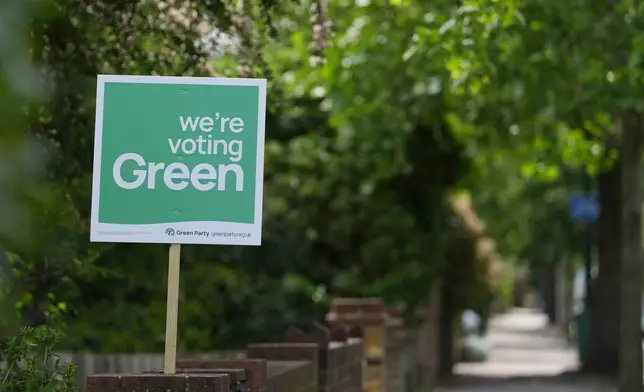A Green Party political sign put up by the householder to show support ahead of local council elections in London, Wednesday, May 6, 2026. (AP Photo/Alastair Grant)