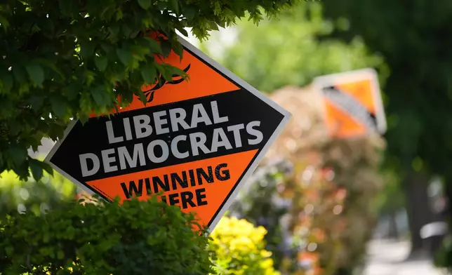 Liberal Democrats political sign put up by the householders to show support ahead of local council elections in London, Wednesday, May 6, 2026. (AP Photo/Alastair Grant)