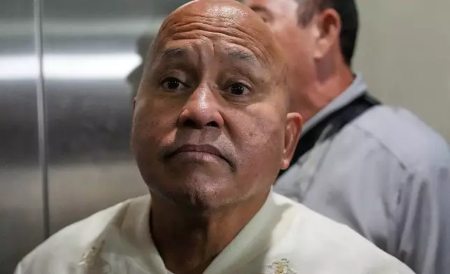 Philippine Senator Ronald dela Rosa listens to reporters as he responds to questions about his unsealed ICC warrant of arrest at the Philippine Senate in Pasay, Philippines on Tuesday, May 12, 2026. (AP Photo/Aaron Favila)