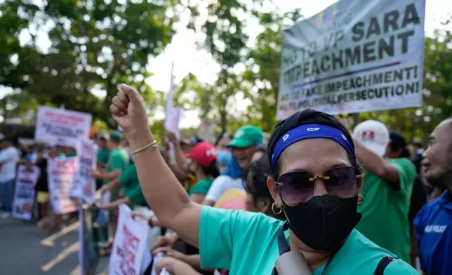 A supporter of former Senator Ronald dela Rosa and Vice President Sara Duterte gestures as they hold a rally outside the Philippine Senate in Pasay, Philippines on Tuesday, May 12, 2026. (AP Photo/Aaron Favila)