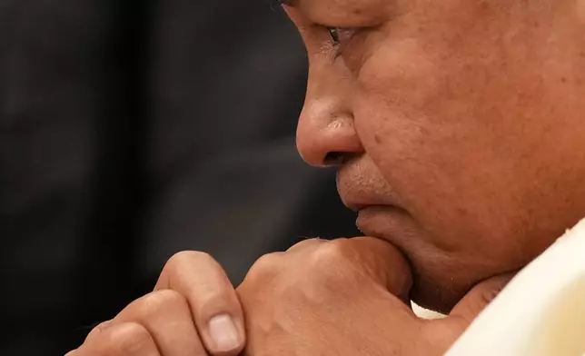 Philippine Senator Ronald dela Rosa becomes emotional while talking with other senators before the start of the session at the Philippine Senate in Pasay, Philippines on Tuesday, May 12, 2026. (AP Photo/Aaron Favila)