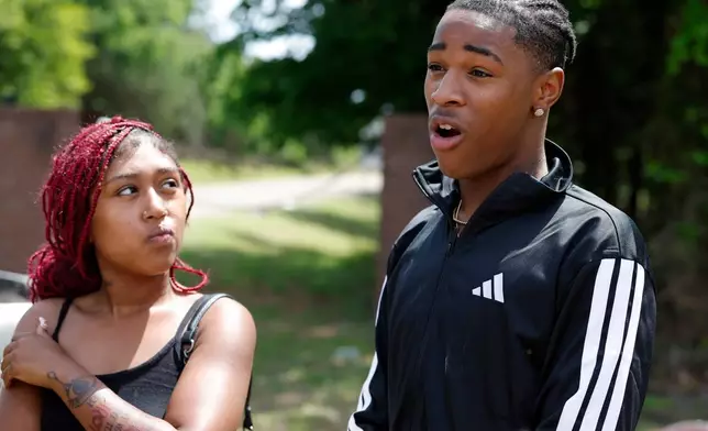 Jeremiah Braxton, who was at the party, talks to the media at the entrance to Scissortail Campground at Arcadia Lake in Edmond, Okla. on Monday, May 4, 2026 after a shooting on Sunday evening. (AP Photo/Alonzo Adams)