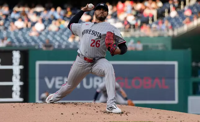 Minnesota Twins starting pitcher Taj Bradley throws to the Washington Nationals during the first inning of a baseball game, Tuesday, May 5, 2026, in Washington. (AP Photo/Jess Rapfogel)