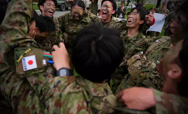Japanese cadets celebrate after completing the crucible portion of the Sandhurst Military Skills Competition at the United States Military Academy in West Point, N.Y., Saturday, May 2, 2026. (AP Photo/Julia Demaree Nikhinson)