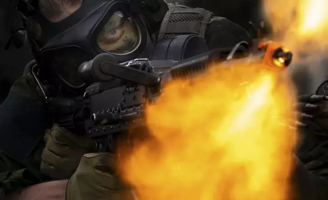 Finnish cadets shoot blanks during the crucible portion of the Sandhurst Military Skills Competition at the United States Military Academy in West Point, N.Y., Saturday, May 2, 2026. (AP Photo/Julia Demaree Nikhinson)