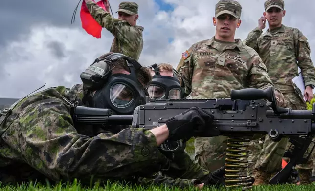 Finnish cadets shoot blanks during the crucible portion of the Sandhurst Military Skills Competition at the United States Military Academy in West Point, N.Y., Saturday, May 2, 2026. (AP Photo/Julia Demaree Nikhinson)