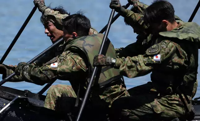 Japanese army cadets row a zodiac boat during the Sandhurst Military Skills Competition at the United States Military Academy in West Point, N.Y., Friday, May 1, 2026. (AP Photo/Julia Demaree Nikhinson)