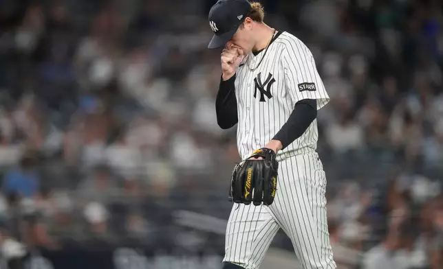 New York Yankees pitcher Cam Schlittler (31) walks to dugout during the seventh inning of a baseball game against the New York Yankees, Wednesday, May 20, 2026, in New York. (AP Photo/Yuki Iwamura)