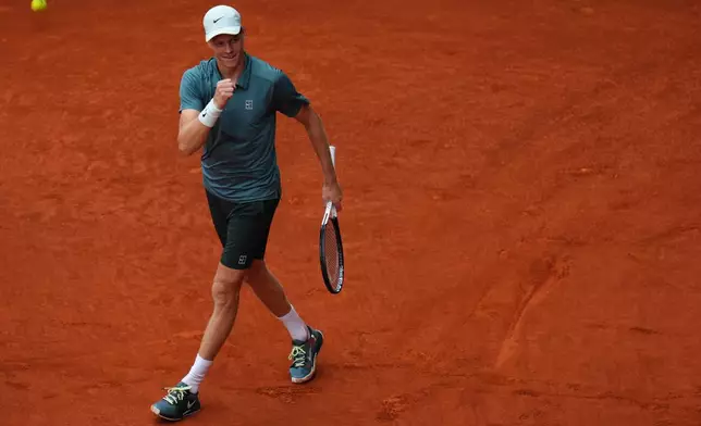 Jannik Sinner, of Italy, celebrates after winning the men's singles tennis final match against Alexander Zverev, of Germany, at the Madrid Open tennis tournament in Madrid, Spain, Sunday, May 3, 2026. (AP Photo/Manu Fernandez)