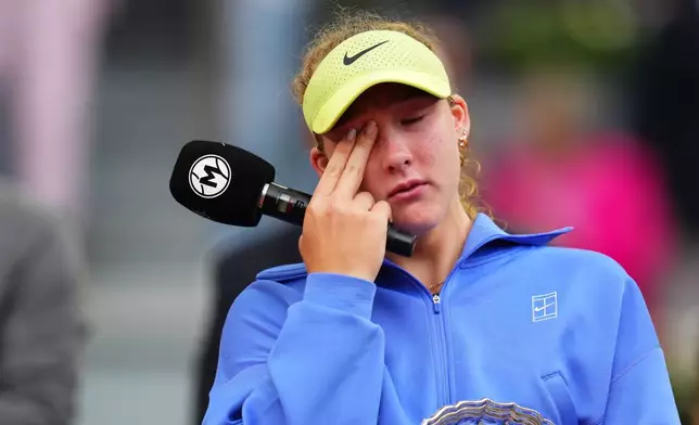 Mirra Andreeva reacts after the final match at the Madrid Open tennis tournament in Madrid, Spain, Saturday, May 2, 2026. (AP Photo/Manu Fernandez)
