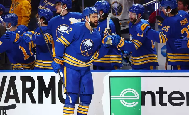 Buffalo Sabres left wing Jordan Greenway, center, celebrates his goal during the second period in Game 1 of a second-round NHL hockey Stanley Cup playoff series against the Montreal Canadiens, Wednesday, May 6, 2026, in Buffalo, N.Y. (AP Photo/Jeffrey T. Barnes)