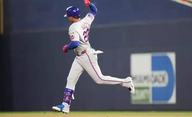 New York Mets' Juan Soto runs the bases after hitting a solo home run during the first inning of a baseball game against the Miami Marlins, Friday, May 22, 2026, in Miami. (AP Photo/Lynne Sladky)