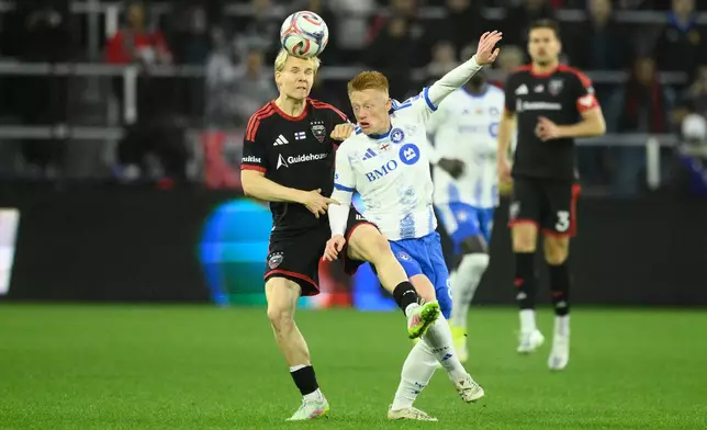 D.C. United defender Matti Peltola, left, and CF Montreal midfielder Matty Longstaff, front right, battle for the ball during the first half of an MLS soccer match, Saturday, May 23, 2026, in Washington. (AP Photo/Nick Wass)