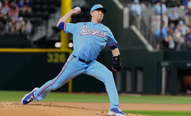 Texas Rangers pitcher Jacob deGrom throws to Chicago Cubs' Seiya Suzuki and gets his 1,900th career strikeout in the first inning of a baseball game Sunday, May 10, 2026, in Arlington, Texas. (AP Photo/Tony Gutierrez)