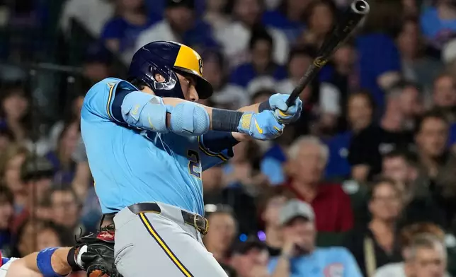 Milwaukee Brewers' Christian Yelich hits a one-run double during the sixth inning of a baseball game against the Chicago Cubs in Chicago, Monday, May 18, 2026. (AP Photo/Nam Y. Huh)