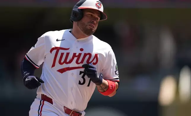 Minnesota Twins' Victor Caratini (37) runs the bases after hitting a solo home run during the second inning of a baseball game against the Houston Astros, Wednesday, May 20, 2026, in Minneapolis. (AP Photo/Abbie Parr)