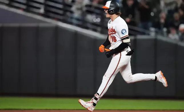 Baltimore Orioles' Coby Mayo rounds the bases after hitting a three-run home run during the seventh inning of a baseball game against the New York Yankees, Monday, May 11, 2026, in Baltimore. (AP Photo/Stephanie Scarbrough)
