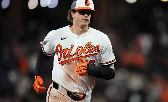 Baltimore Orioles' Coby Mayo rounds the bases after hitting a three-run home run during the seventh inning of a baseball game against the New York Yankees, Monday, May 11, 2026, in Baltimore. (AP Photo/Stephanie Scarbrough)