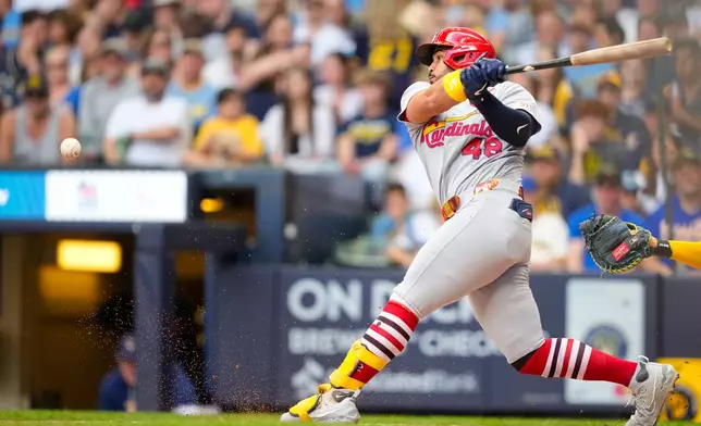 St. Louis Cardinals' Iván Herrera hits a groundout to third base, allowing Victor Scott II to score, during the sixth inning of a baseball game against the Milwaukee Brewers, Monday, May 25, 2026, in Milwaukee. (AP Photo/Kayla Wolf)