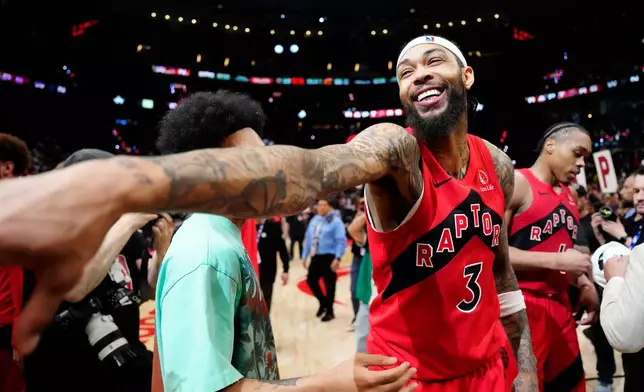 Toronto Raptors forward Brandon Ingram (3) celebrates after Game 4 in a first-round NBA basketball playoffs series against the Cleveland Cavaliers in Toronto, Sunday, April 26, 2026. (Frank Gunn/The Canadian Press via AP)