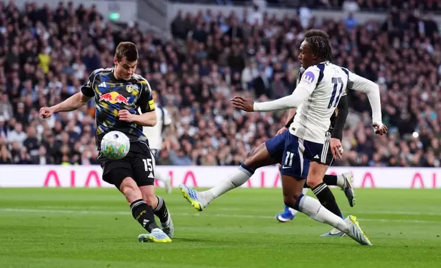 Tottenham Hotspur's Mathys Tel, right, shoots towards goal during the English Premier League soccer match between Tottenham Hotspur and Leeds United in London, Monday May 11, 2026. (John Walton/PA via AP)
