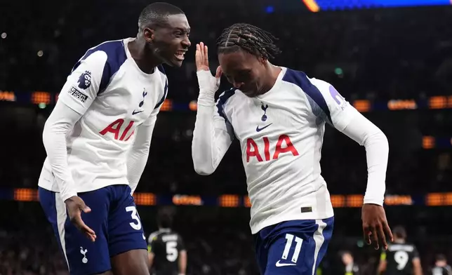 Tottenham Hotspur's Mathys Tel, right, celebrates scoring during the English Premier League soccer match between Tottenham Hotspur and Leeds United in London, Monday May 11, 2026. (John Walton/PA via AP)