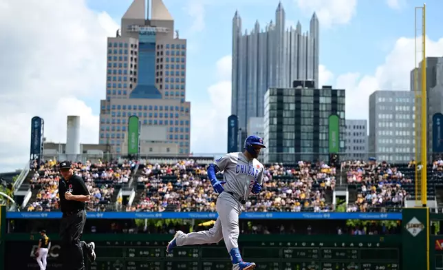Chicago Cubs' Michael Busch runs the bases after hitting a solo home run off Pittsburgh Pirates starting pitcher Carmen Mlodzinski during the fifth inning of a baseball game, Monday, May 25, 2026, in Pittsburgh. (AP Photo/David Dermer)