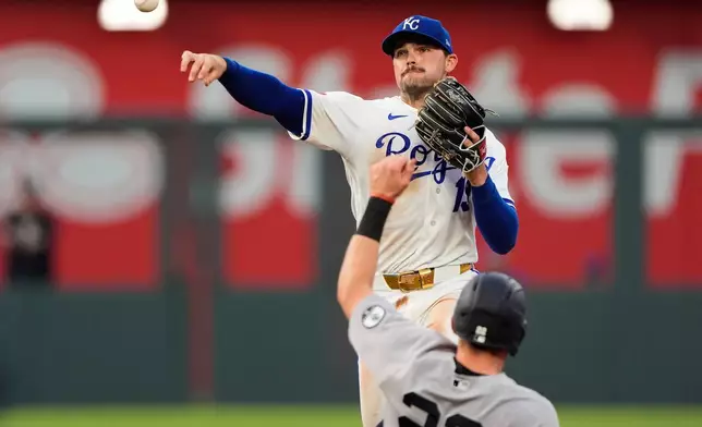 Kansas City Royals second baseman Michael Massey throws to first for the double play hit into by New York Yankees' Aaron Judge after forcing Ben Rice (22) out at second during the sixth inning of baseball game Wednesday, May 27, 2026, in Kansas City, Mo. (AP Photo/Charlie Riedel)