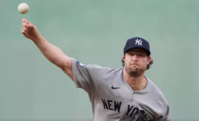 New York Yankees starting pitcher Gerrit Cole throws during the first inning of baseball game against the Kansas City Royals, Wednesday, May 27, 2026, in Kansas City, Mo. (AP Photo/Charlie Riedel)