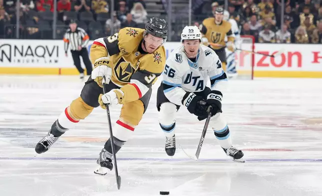 Vegas Golden Knights defenseman Brayden McNabb (3) and Utah Mammoth right wing Kailer Yamamoto (56) skate after a loose puck during the third period in Game 2 of a first-round NHL hockey Stanley Cup playoff series Tuesday, April 21, 2026, in Las Vegas. (AP Photo/Ian Maule)