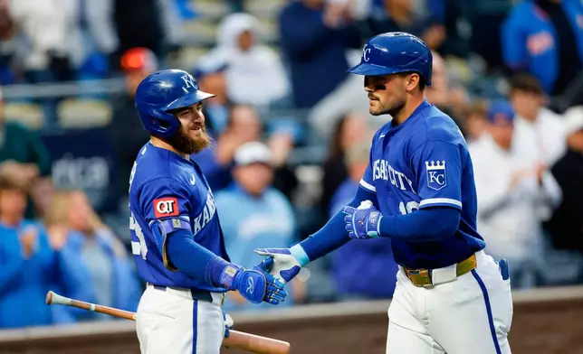 Kansas City Royals' Michael Massey, celebrates his two-run home run with Kyle Isbel, left, during the fourth inning of a baseball game against the Cleveland Guardians in Kansas City, Mo., Tuesday, May 5, 2026. (AP Photo/Colin E. Braley)