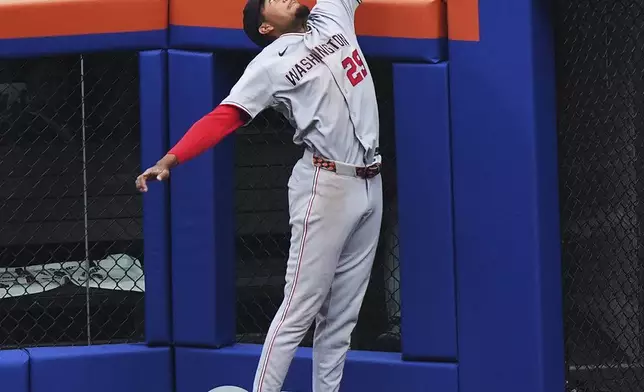 Washington Nationals' James Wood (29) catches a ball hit by New York Mets' Juan Soto for an out during the first inning of a baseball game Thursday, April 30, 2026, in New York. (AP Photo/Frank Franklin II)
