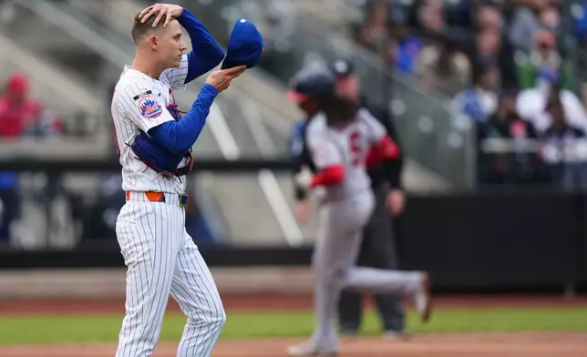 New York Mets pitcher Luke Weaver, left, reacts as Washington Nationals' CJ Abrams runs the bases after hitting a two run home run during the eighth inning of a baseball game Thursday, April 30, 2026, in New York. (AP Photo/Frank Franklin II)