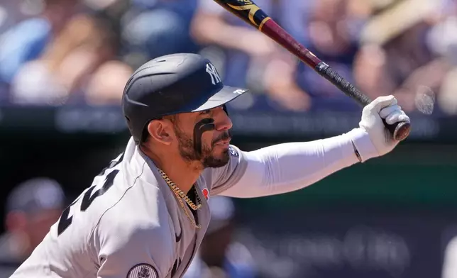 New York Yankees' Jose Caballero watches his RBI single during the second inning of baseball game against the Kansas City Royals, Monday, May 25, 2026, in Kansas City, Mo. (AP Photo/Charlie Riedel)