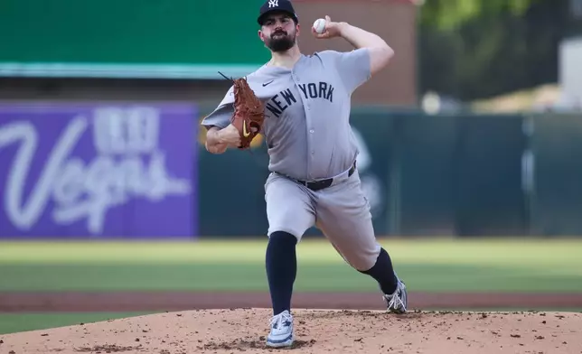 New York Yankees pitcher Carlos Rodón throws to an Athletics batter during the first inning of a baseball game Friday, May 29, 2026, in West Sacramento, Calif. (AP Photo/Scott Marshall)