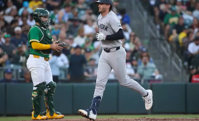 New York Yankees' Ryan McMahon heads to the dugout after hitting a solo home run during the third inning of a baseball game against the Athletics Friday, May 29, 2026, in West Sacramento, Calif. (AP Photo/Scott Marshall)