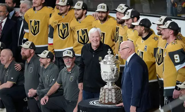 Vegas Golden Knights owner Bill Foley, middle, celebrate after winning Game 4 of the Western Conference finals NHL hockey Stanley Cup playoff series against the Colorado Avalanche Tuesday, May 26, 2026, in Las Vegas. (AP Photo/John Locher)