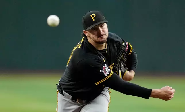 Pittsburgh Pirates starting pitcher Paul Skenes warms up during the first inning of a baseball game against the Arizona Diamondbacks, Wednesday, May 6, 2026, in Phoenix. (AP Photo/Ross D. Franklin)