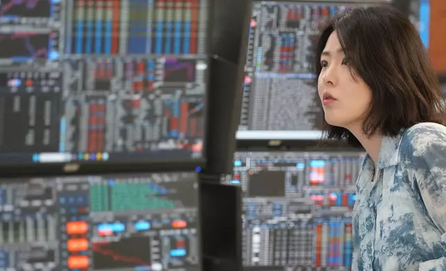A dealer watches computer monitors at a dealing room of Hana Bank in Seoul, South Korea, Wednesday, May 6, 2026. (AP Photo/Lee Jin-man)