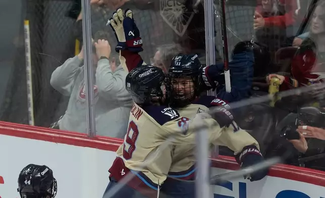 Montreal Victoire forward Abby Roque (right) celebrates her goal with forward Marie-Philip Poulin (29) during the second period of game 4 PWHL Walter Cup final hockey game in Ottawa, Wednesday, May 20, 2026. (Adrian Wyld/The Canadian Press via AP)