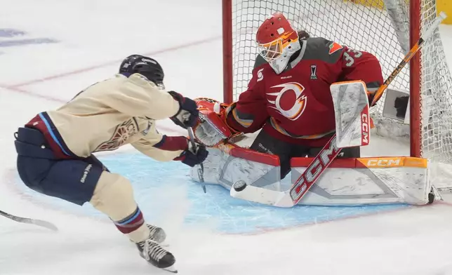 Montreal Victoire forward Catherine Dubois (28) shoots on Ottawa Charge goalie Gwyneth Philips (33) during the second period of game 4 PWHL Walter Cup final hockey game in Ottawa, Wednesday, May 20, 2026. (Adrian Wyld/The Canadian Press via AP)